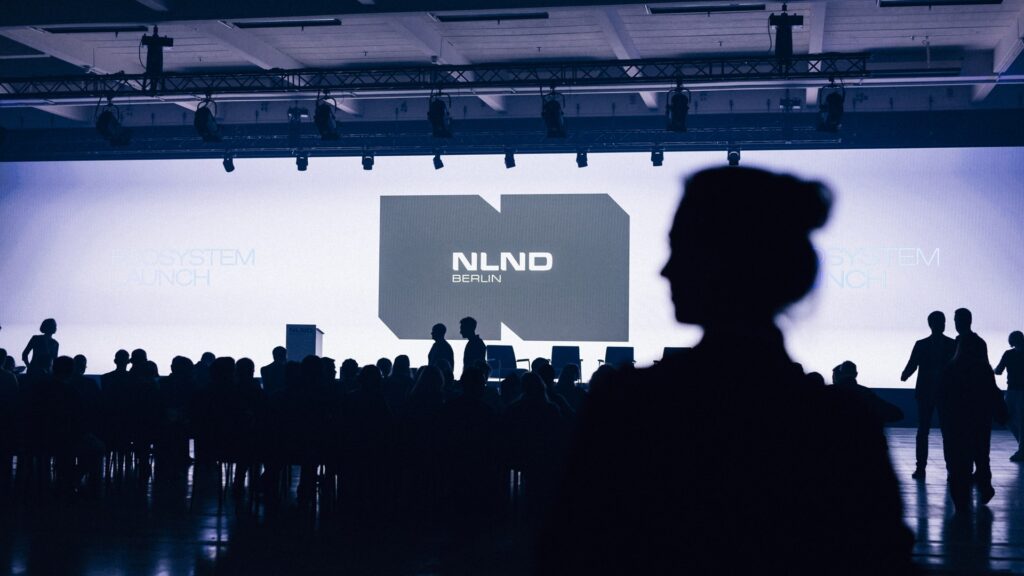 NLND Berlin logo on the stage screen at the Ecosystem Launch